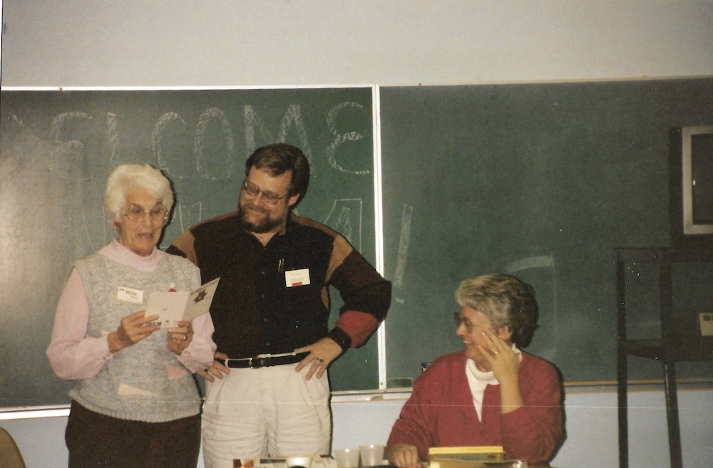 NFWM Bd Mtg, Monroe MI 12/11/92. President Millie Moser Smith presenting Thank You to Jon Lacey for serving as Associate Director as Pat Drydyk looks on. Photo by Ricardo Corneio
